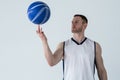 Basketball player spinning ball on his finger Royalty Free Stock Photo