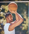 Basketball player, sports and training with fitness man with ball ready to shoot or throw while playing at an outdoor Royalty Free Stock Photo