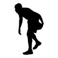 Basketball player standing, dribbling the ball