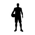 Basketball player standing and holding ball