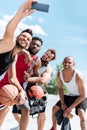 Basketball players taking selfie together