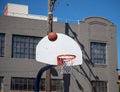 Basketball rebounding after a missed shot on an outdoor streetba