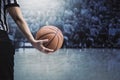 Basketball referee holding ball at a basketball game during a timeout Royalty Free Stock Photo