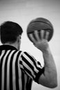 Basketball Referee Holding Ball Black and White Stripes