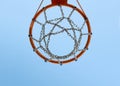 Basketball rim with blue sky in the background