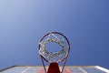 Basketball ring and board with white net.