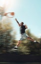 Basketball, sports and goals with man and jump in park court training for fitness, health and workout. Energy, action Royalty Free Stock Photo