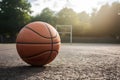 Basketball on sunny outdoor court, ready for game action Royalty Free Stock Photo