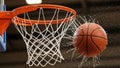 Basketball swishing through net with water splash effect Royalty Free Stock Photo