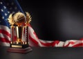 Basketball trophy and American flag Royalty Free Stock Photo