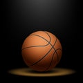 Basketball under spotlight Royalty Free Stock Photo