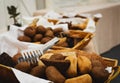 Basketful of ciabatta bread on a buffet table Royalty Free Stock Photo