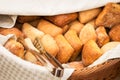 Basketful of ciabatta bread with tongs Royalty Free Stock Photo