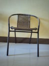 A basketry chair with steel chairs. Textured basketry chair furniture, selective focus.