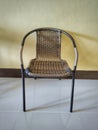 A basketry chair with steel chairs. Textured basketry chair furniture, selective focus.