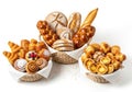 Baskets of assorted fresh bread and pastry assortment on a white surface with a slight shadow Royalty Free Stock Photo