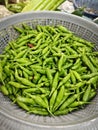 baskets of fresh green mini chili peper.