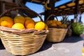 Baskets full of beautiful oranges for sale at the farmer's market on a bright, sunny morning. Royalty Free Stock Photo