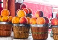 Baskets of peaches at a farmers market Royalty Free Stock Photo