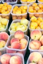 Baskets of peaches and plums Royalty Free Stock Photo