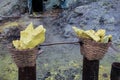Baskets of sulfur ore mined from Mount Ijen, Indonesia. Royalty Free Stock Photo