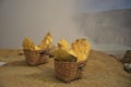 Baskets of sulphur out of Ijen crater