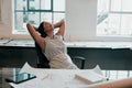 Basking in total job satisfaction. a female architect looking relaxed at her desk. Royalty Free Stock Photo