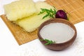 Basmati rice flour in ceramic bowl, rice noodles, chopsticks and soy sauce on sushi bamboo mat Royalty Free Stock Photo