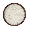 Basmati rice groats in wooden bowl isolated on white background. Top view Royalty Free Stock Photo