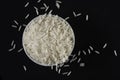 White basmati rice in white bowl on black background Royalty Free Stock Photo
