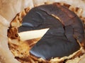 Basque burnt cheesecake with a rich, dark caramelized exterior surface and jiggly middle