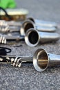 Bass clarinets on pavement, horn close-up Royalty Free Stock Photo