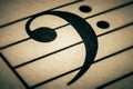 Bass clef symbol on a musical chart or partition or part macro close-up Royalty Free Stock Photo