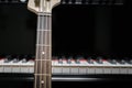 Bass guitar against grand piano keys Royalty Free Stock Photo