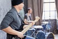 Bass guitarist and drummer play music Royalty Free Stock Photo