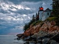 Bass Harbor Lighthouse and stormclouds at dusk Royalty Free Stock Photo