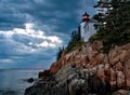 Bass Harbor Lighthouse and stormclouds at dusk Royalty Free Stock Photo