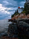 Bass Harbor Lighthouse and stormclouds at dusk Royalty Free Stock Photo