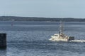 Lobster boat Poseidon leaving port Royalty Free Stock Photo