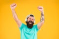 Bass low sound. Hipster headphones gadget. Inspiring song. Music library. Feel rhythm. Bearded guy enjoy music Royalty Free Stock Photo