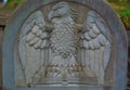 Bass relief of an eagle with a book