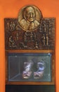 Bass relief with scenes from the life of Saint Mother Teresa of Calcutta and her sandals
