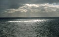 Bass Strait prior to a storm a few sun rays break through a stormy sky.