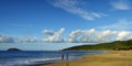 People taking sun bath in the sunset on the beautiful Plage De La Perle on Basse-Terre on Guadeloupe island