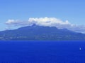 Basse Terre in guadeloupe seen from les Saintes, ocean and soufriere volcano in the cloud