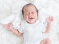 A bastard newborn baby crying in bed Because she was hungry and sick