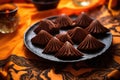 bat-shaped chocolate truffles on an orange silk cloth