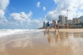 Bat Yam, Israel - 14 July, 2014. Tourists walking on the sandy beach