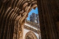 Low angle shot to emphasize the majestic entrance portal to the unfinished chapels of the Monastery of Batalha in Portugal