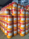 Piles of Jotun brand paint cans.